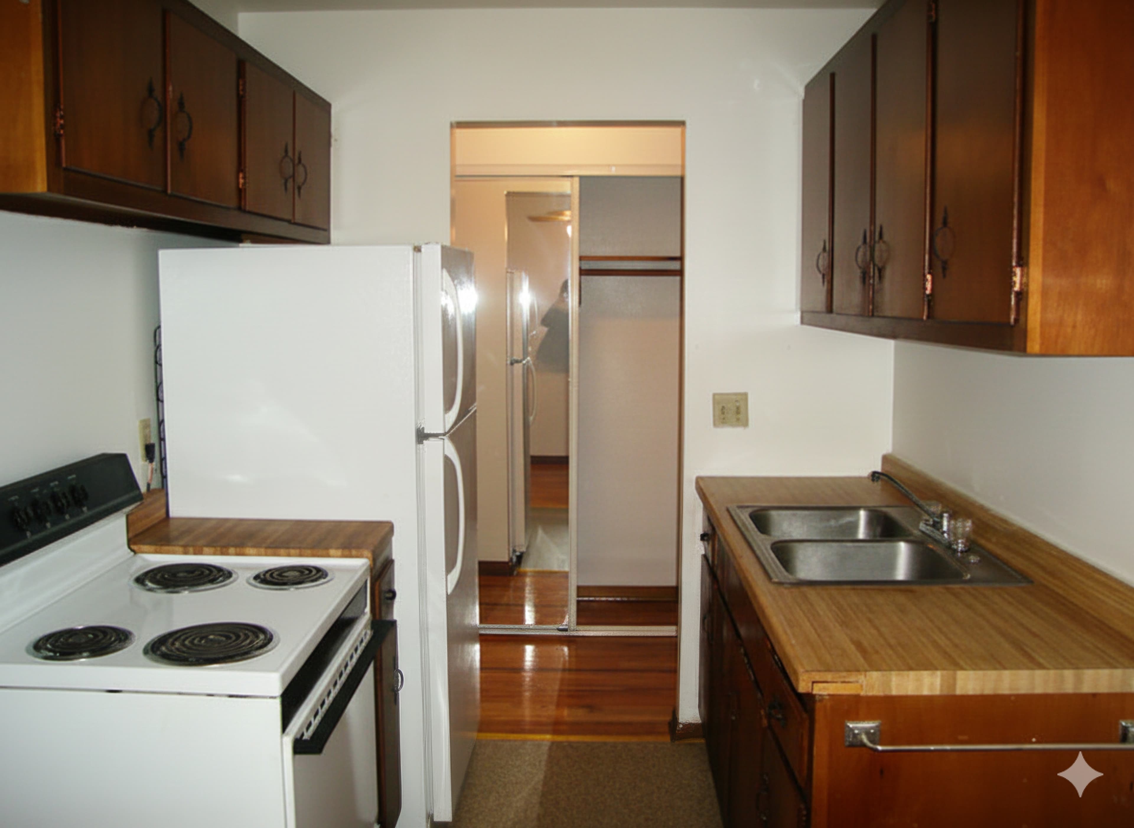 Kitchen with white appliances and wood cabinets
