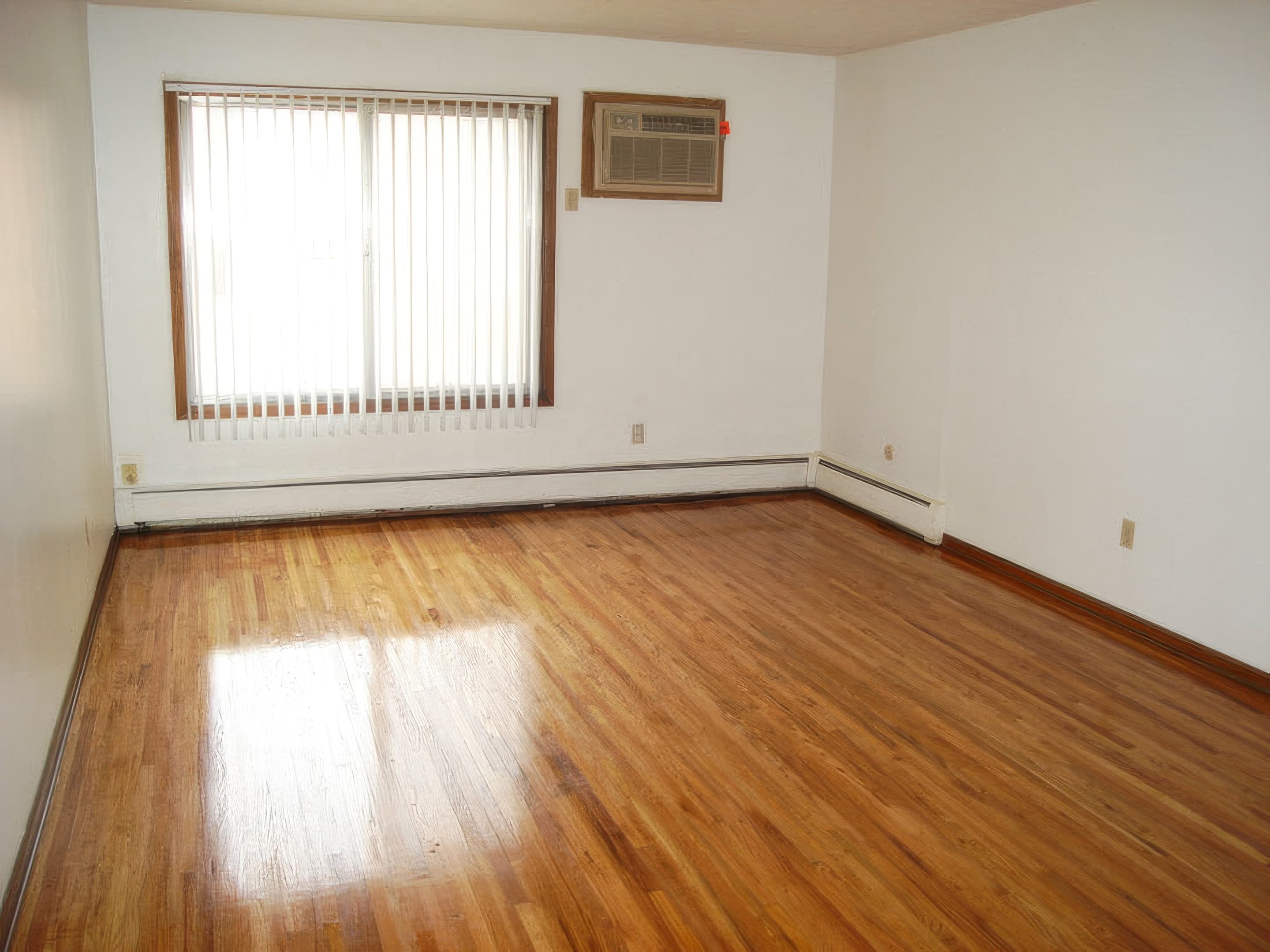 Studio apartment with hardwood floors and natural light